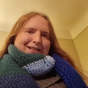 A knitted blue striped  scarf